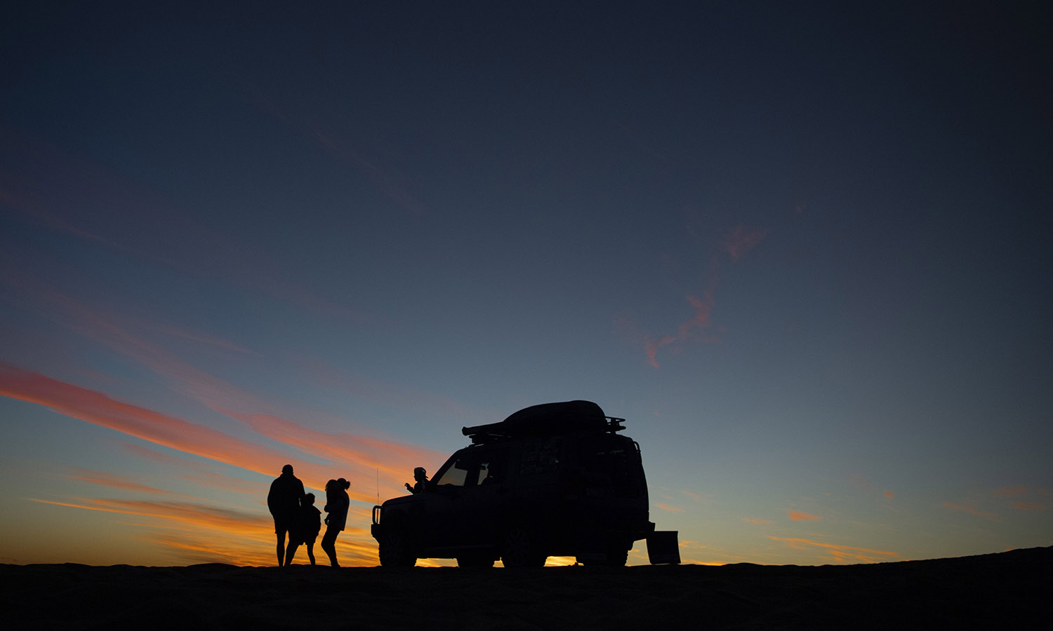 Car at sunset in Australian outback.